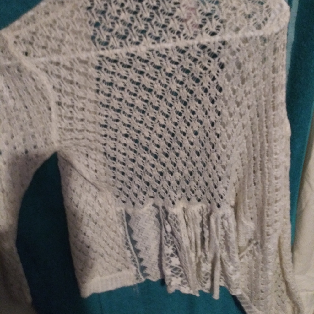 White lace. Light sweater.